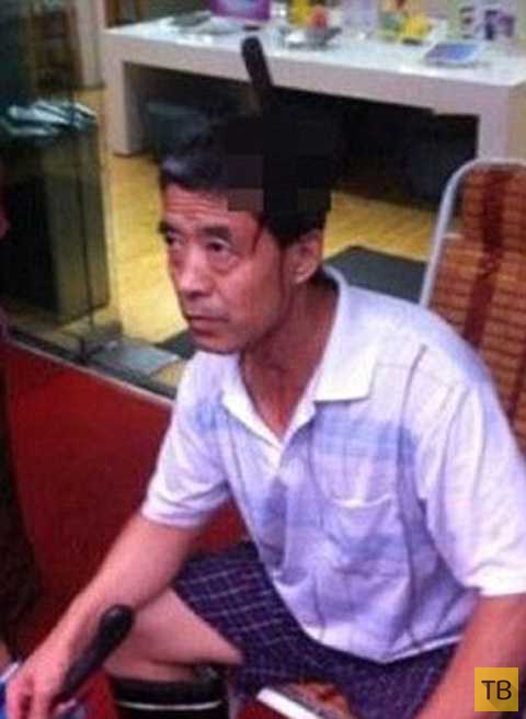 Проходивший под многоэтажкой китаец получил травму (5 фото)